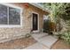 Welcoming front entrance with stone facade and steps leading to a decorative front door at 19411 E Milan Cir, Aurora, CO 80013