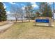 A tranquil park setting with a walking path and clear signage for Sunrise Park at 19411 E Milan Cir, Aurora, CO 80013