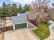 Desirable home with an attached garage, lush lawn, and beautiful landscaping at 6282 Yank Ct, Arvada, CO 80004
