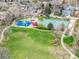 Community aerial view features a park, playground, and tennis court at 6282 Yank Ct, Arvada, CO 80004