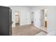 A bedroom offers carpet, neutral walls, and multiple doorways leading to the bathroom and closet at 6282 Yank Ct, Arvada, CO 80004