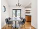 Modern dining room featuring a stylish table and chairs with hardwood floors at 6282 Yank Ct, Arvada, CO 80004