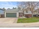Charming home featuring an attached garage, well-maintained lawn, and tasteful landscaping at 6282 Yank Ct, Arvada, CO 80004