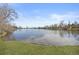 Picturesque lake view showcasing calm waters and serene surrounding landscape, ideal for relaxation and nature walks at 6282 Yank Ct, Arvada, CO 80004