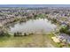 Scenic lake view with walking path and green space nearby at 6282 Yank Ct, Arvada, CO 80004
