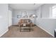 Cozy living room with carpet, neutral paint, a comfortable sofa, a coffee table, and modern decor at 6282 Yank Ct, Arvada, CO 80004