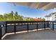 Balcony featuring views of mature trees and surrounding neighborhood at 555 E 10Th Ave # 206, Denver, CO 80203