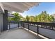 Spacious balcony with views of mature trees and neighborhood surroundings at 555 E 10Th Ave # 206, Denver, CO 80203