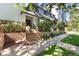 Apartment complex featuring well maintained brick accents, mature trees, and professional landscaping at 555 E 10Th Ave # 206, Denver, CO 80203