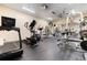 Well-equipped exercise room with modern machines, mirrored walls, and rubber flooring for comfortable workouts at 555 E 10Th Ave # 206, Denver, CO 80203