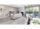 Inviting living room featuring a cozy fireplace, balcony access, and neutral decor at 555 E 10Th Ave # 206, Denver, CO 80203