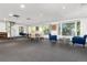Bright living room features a spiral staircase, large windows, and plenty of space at 555 E 10Th Ave # 206, Denver, CO 80203