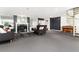 Inviting living room with fireplace, spiral staircase, comfortable sofas and coffee table at 555 E 10Th Ave # 206, Denver, CO 80203