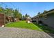 Well-maintained backyard with a hot tub, dining area, stone pathway, and lush green grass at 3275 19Th St, Boulder, CO 80304