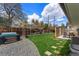Backyard with a hot tub, patio, lush lawn, and privacy fence at 3275 19Th St, Boulder, CO 80304