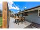 Backyard patio featuring an outdoor dining table, grill, and privacy screens at 3275 19Th St, Boulder, CO 80304