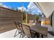 Backyard patio featuring a dining area, grill, and privacy fence at 3275 19Th St, Boulder, CO 80304