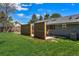 Spacious backyard with a dining area on the patio and a lush green lawn at 3275 19Th St, Boulder, CO 80304