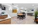 Spacious basement area featuring a dining table, ping pong table, and neutral decor at 3275 19Th St, Boulder, CO 80304