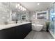Bathroom with stylish tile, modern fixtures, double vanity, a soaking tub, and a glass shower at 3275 19Th St, Boulder, CO 80304