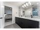Bright bathroom with double vanity, stylish backsplash, and a view into the adjacent bedroom at 3275 19Th St, Boulder, CO 80304