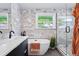 Spa-like bathroom with a luxurious soaking tub, modern fixtures, and a glass-enclosed shower at 3275 19Th St, Boulder, CO 80304