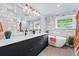 A stylish bathroom features modern fixtures, a double vanity, and a soaking tub at 3275 19Th St, Boulder, CO 80304