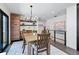 Bright dining room area with a wood table, modern light fixture, and hardwood floors at 3275 19Th St, Boulder, CO 80304