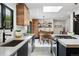 Modern kitchen area with dining area with wooden table and chairs and an open floorplan at 3275 19Th St, Boulder, CO 80304