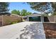 Modern home featuring a driveway, large garage door, and stylish wooden fencing for added privacy at 3275 19Th St, Boulder, CO 80304