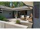 Inviting front porch with contemporary seating, stylish landscaping, and a striking brick exterior at 3275 19Th St, Boulder, CO 80304