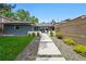 Charming single-story home featuring a well-maintained lawn, stepping stone walkway, and beautifully landscaped front yard at 3275 19Th St, Boulder, CO 80304