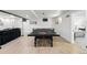 Basement game room with ping pong table, comfortable seating, and bright lighting at 3275 19Th St, Boulder, CO 80304