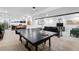 Spacious basement game room with a ping pong table, bar area, and comfortable seating at 3275 19Th St, Boulder, CO 80304
