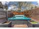 Private hot tub area enclosed by wooden fencing and tasteful landscaping for a relaxing outdoor experience at 3275 19Th St, Boulder, CO 80304
