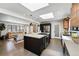 Stylish open kitchen featuring a center island, stainless steel appliances, skylight, and seamless flow into the living area at 3275 19Th St, Boulder, CO 80304