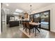Open kitchen and dining area featuring modern appliances, stylish lighting, and access to the backyard at 3275 19Th St, Boulder, CO 80304