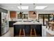 Bright kitchen featuring a center island with a marble countertop, black cabinets, and modern lighting fixtures at 3275 19Th St, Boulder, CO 80304