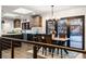 Modern kitchen and dining area featuring sleek cabinets, stainless steel appliances, and access to the backyard at 3275 19Th St, Boulder, CO 80304