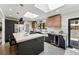 Well-lit kitchen featuring a spacious island with bar seating and sleek, modern cabinetry at 3275 19Th St, Boulder, CO 80304