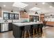 Bright, modern kitchen with a large island, marble countertops, pendant lighting and skylights at 3275 19Th St, Boulder, CO 80304