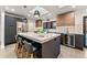 Bright kitchen featuring a large island, modern cabinets, stainless steel appliances, and a dedicated wine fridge at 3275 19Th St, Boulder, CO 80304
