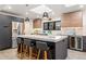 Modern kitchen featuring a large island with seating, stainless steel appliances, and stylish lighting fixtures at 3275 19Th St, Boulder, CO 80304