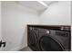 Convenient laundry area with front loading LG washer and dryer and a sleek countertop for folding clothes at 3275 19Th St, Boulder, CO 80304
