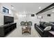 Bright basement living area showcasing a comfortable sofa, chairs, and contemporary decor at 3275 19Th St, Boulder, CO 80304