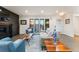 Living room featuring recessed lights, hardwood floors, a modern fireplace, and multiple large windows at 3275 19Th St, Boulder, CO 80304