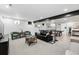 Open basement living area featuring cozy seating, neutral colors, and a modern aesthetic at 3275 19Th St, Boulder, CO 80304