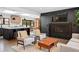 Open-concept living room with a cozy fireplace, modern furnishings, and seamless flow into the kitchen and dining area at 3275 19Th St, Boulder, CO 80304