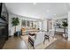Spacious living room with a fireplace, comfortable seating, and large windows offering bright natural light throughout the space at 3275 19Th St, Boulder, CO 80304