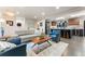 Open-concept living area, showcasing the kitchen, recessed lights, hardwood floors, and bright natural light at 3275 19Th St, Boulder, CO 80304